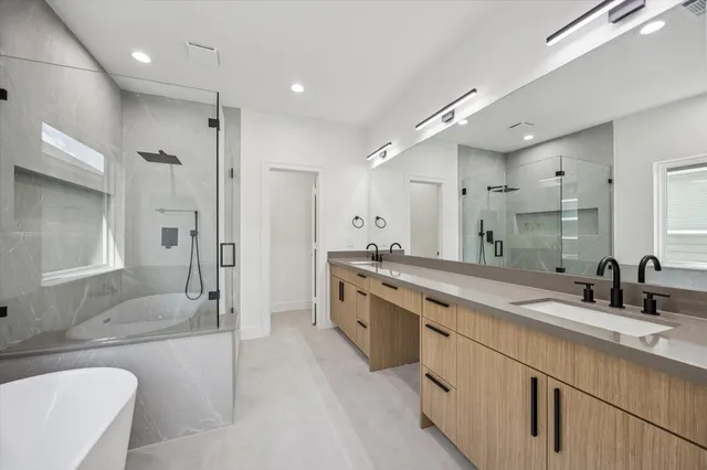 a bathroom with a bathtub and shower