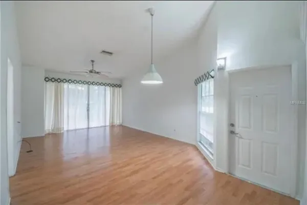 a view of an empty room and window