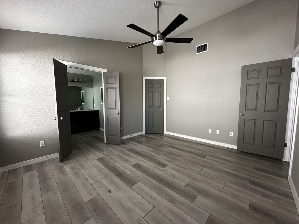 17733 Loch Linnhe Loop Pflugerville, TX 78660 - Photo 14 of 16 a view of a livingroom with a hardwood floor and a ceiling fan