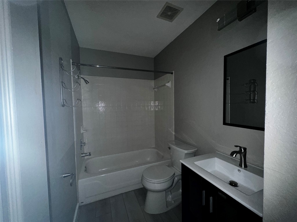 17733 Loch Linnhe Loop Pflugerville, TX 78660 - Photo 10 of 16 a bathroom with a bathtub shower sink vanity and toilet