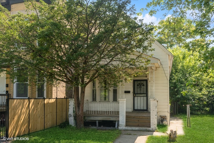 5943 South Aberdeen Street Chicago, IL 60621 - Photo 1 of 8 a view of house with a backyard