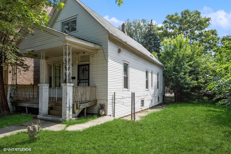 5943 South Aberdeen Street Chicago, IL 60621 - Photo 2 of 8 a view of a house with a backyard