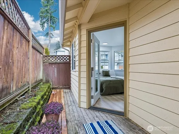 a view of a porch with wooden floor