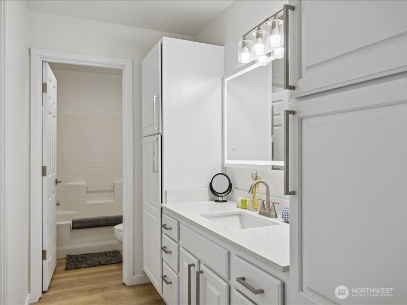 5104 154th Street Southwest Edmonds, WA 98026 - Photo 19 of 25 a bathroom with a sink a mirror and a shower