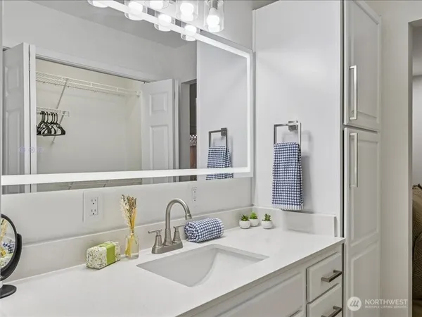 a bathroom with a sink and a mirror