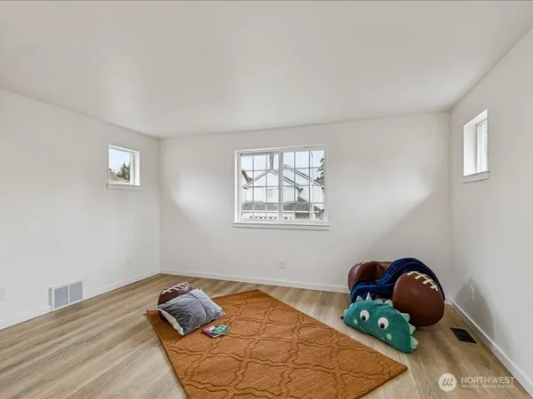 a room with bed and window