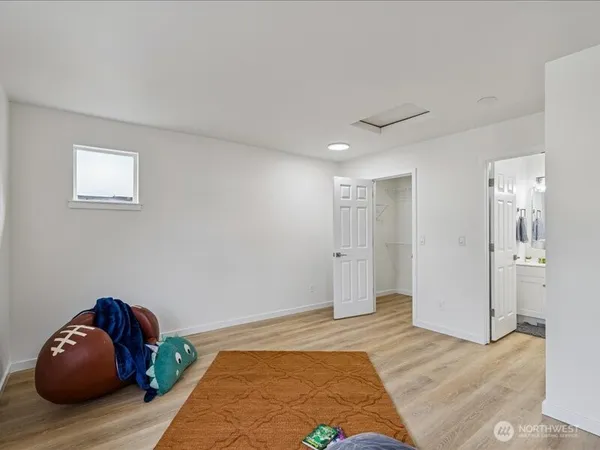 a bedroom with a bed and closet