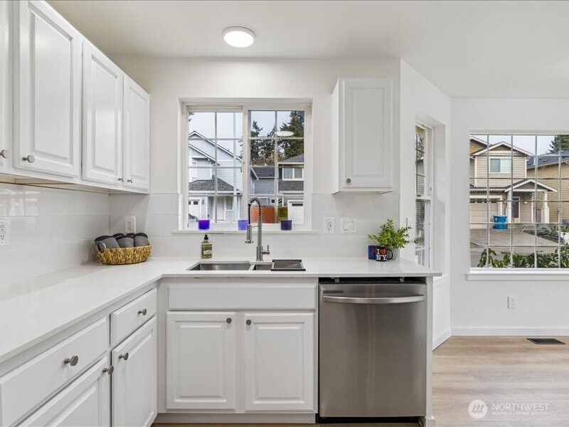 5104 154th Street Southwest Edmonds, WA 98026 - Photo 6 of 25 a kitchen with a sink cabinets and window