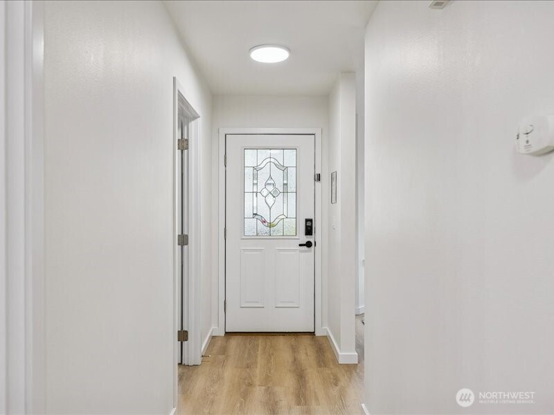 5104 154th Street Southwest Edmonds, WA 98026 - Photo 9 of 25 a view of a hallway with wooden floor