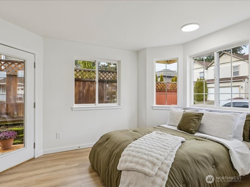 5104 154th Street Southwest Edmonds, WA 98026 - Photo 10 of 25 a bedroom with a bed and a window