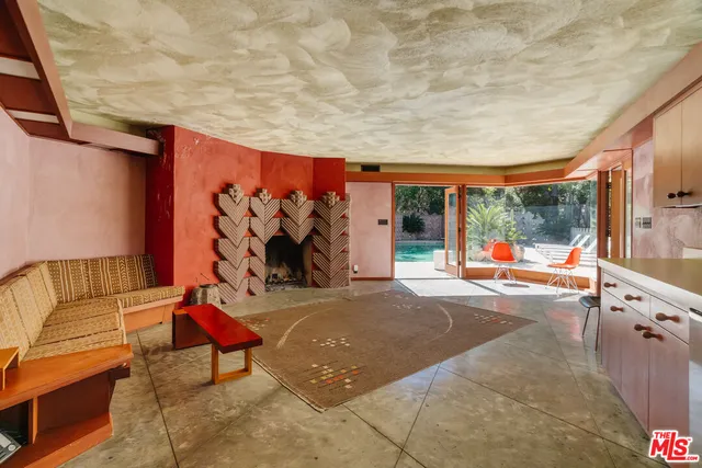 a pathway of a house with large trees