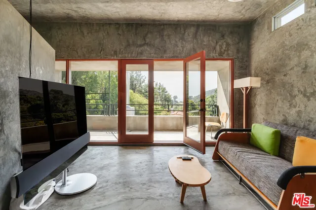a view of a balcony with chairs