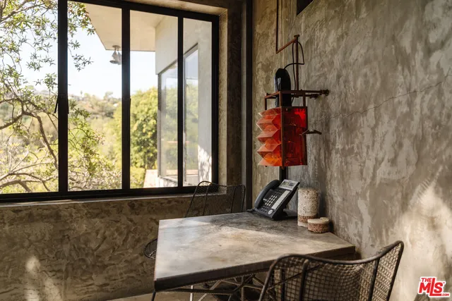 a living room with lots of furniture and a hard wood floor