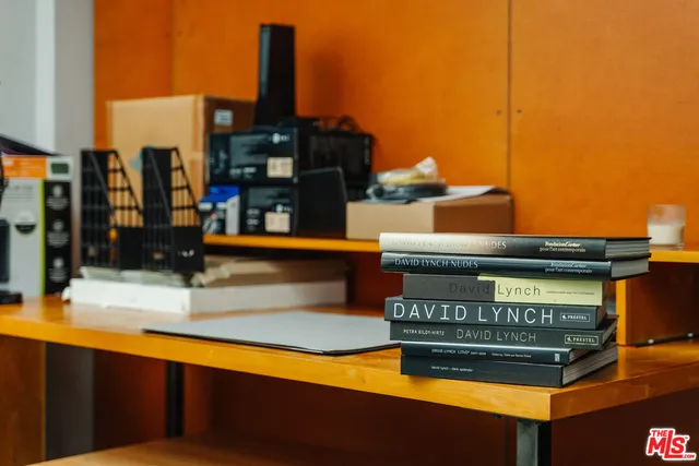a living room with furniture a rug and a large window