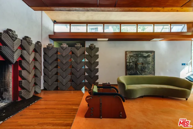 a view of a living room with furniture and a rug