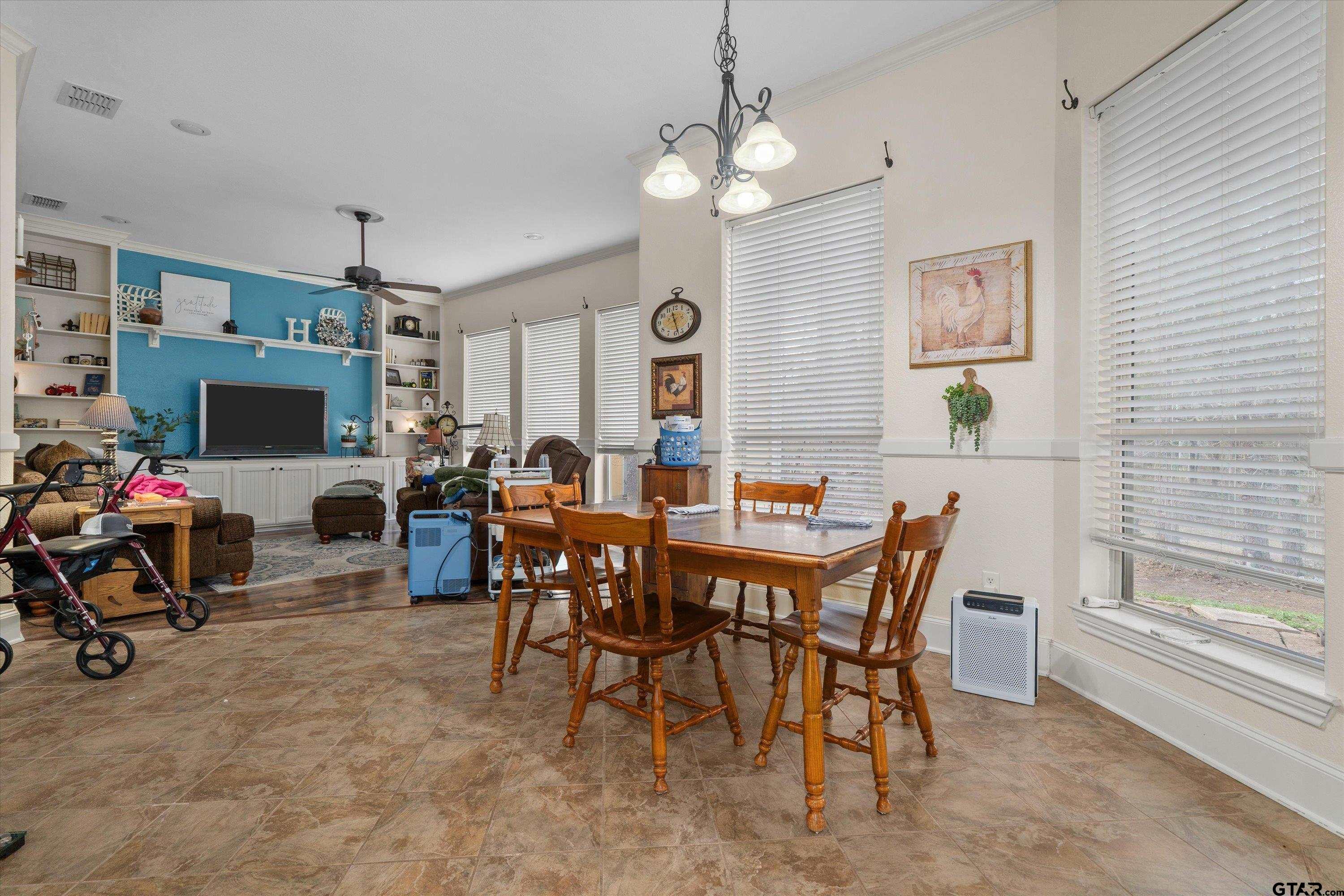 12170 Copper Court Tyler, TX 75706 - Photo 16 of 35 a view of a dining room with furniture and a large window