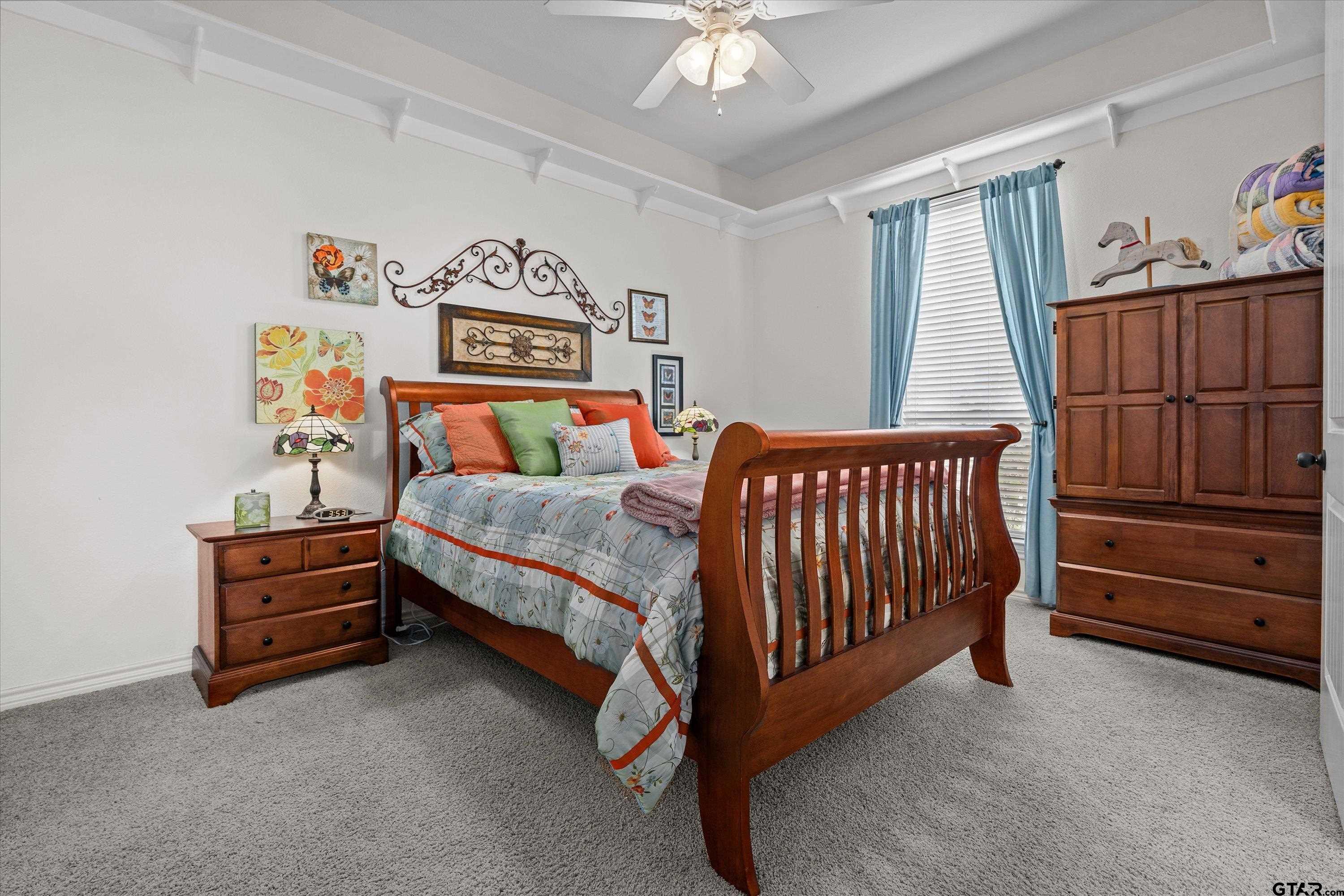 12170 Copper Court Tyler, TX 75706 - Photo 24 of 35 a bedroom with a bed and a window