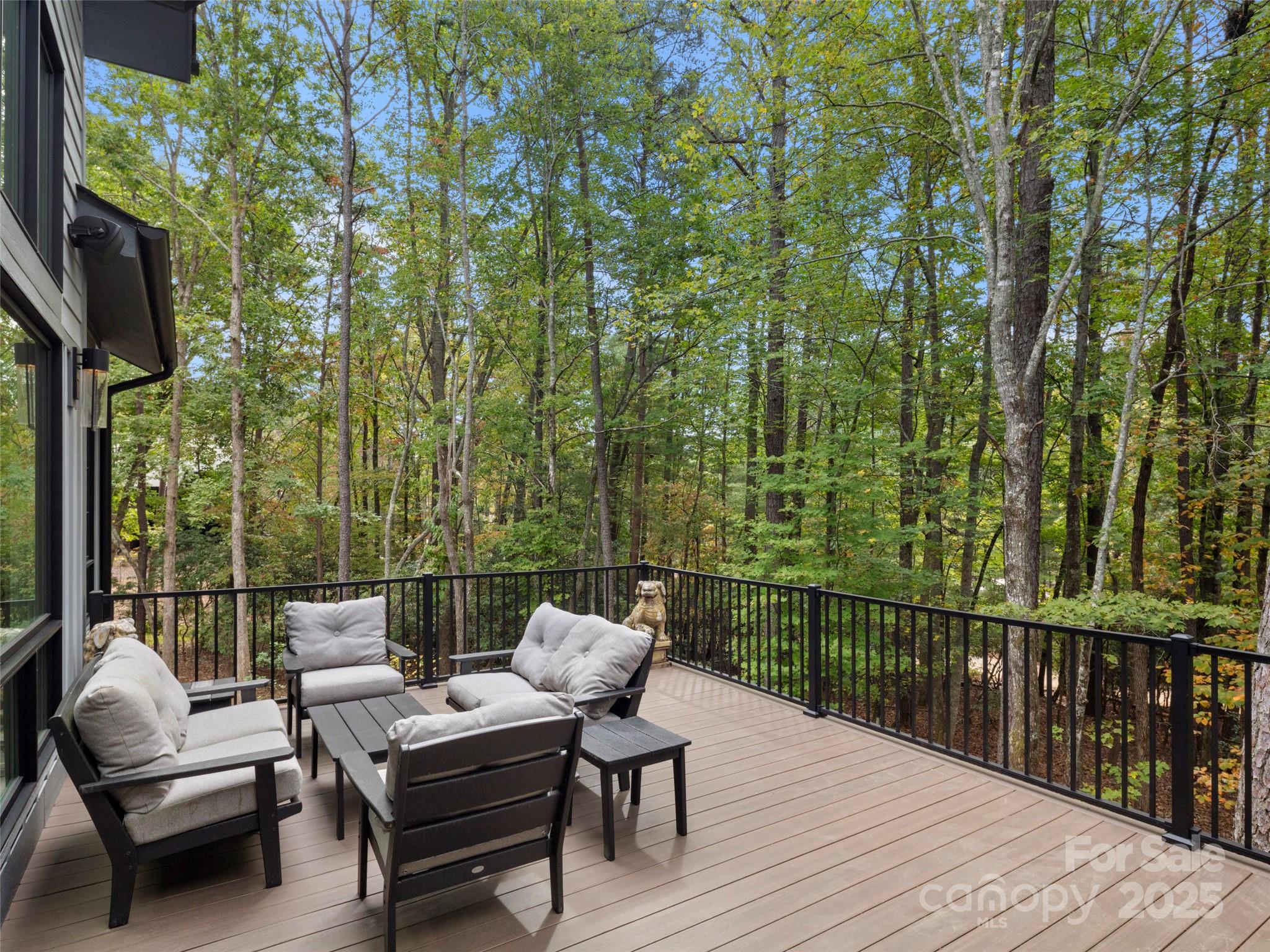 1565 Country View Way Arden, NC 28704 - Photo 18 of 31 a balcony with furniture and wooden floor