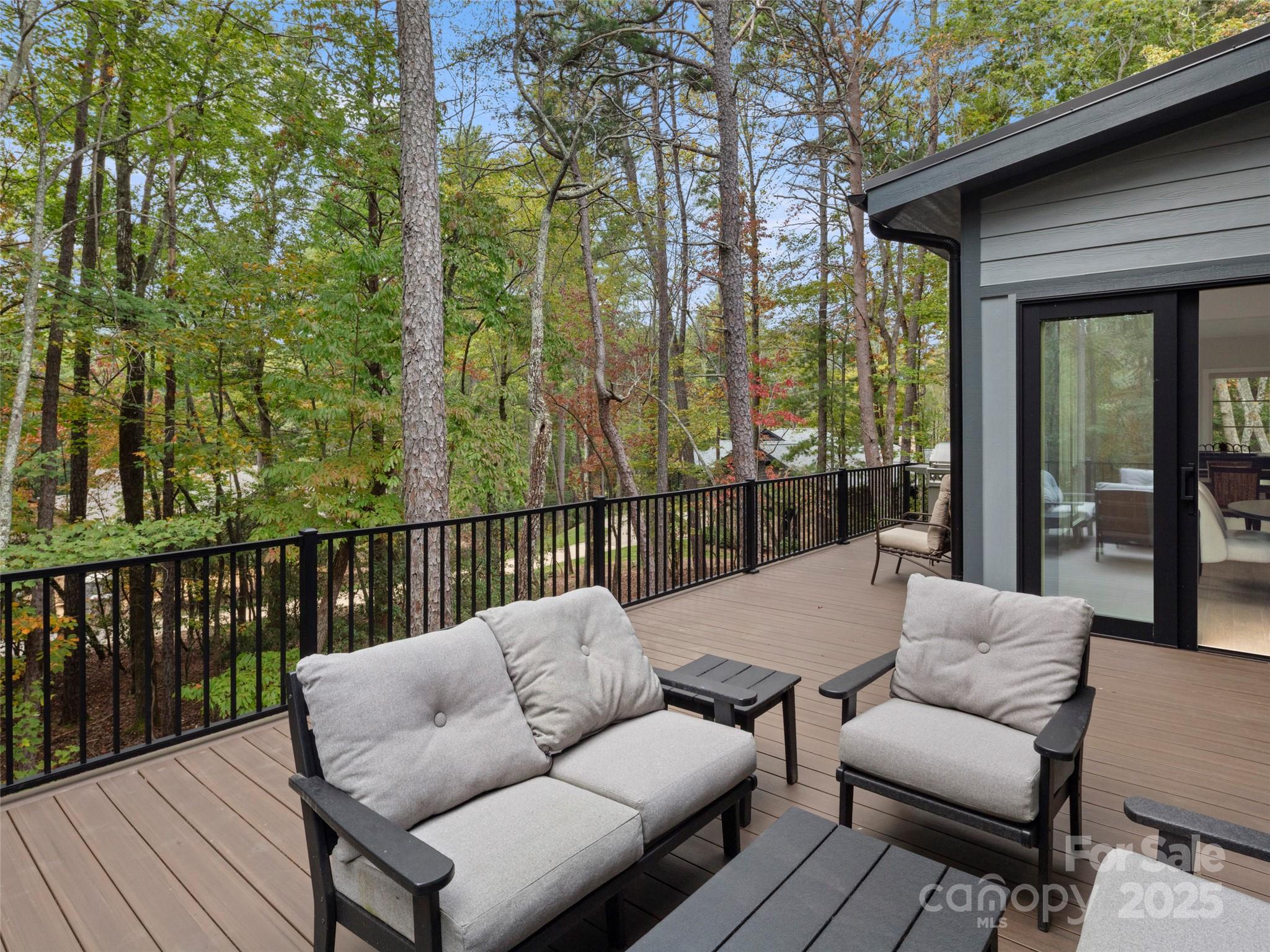 1565 Country View Way Arden, NC 28704 - Photo 19 of 31 a balcony with furniture and wooden floor