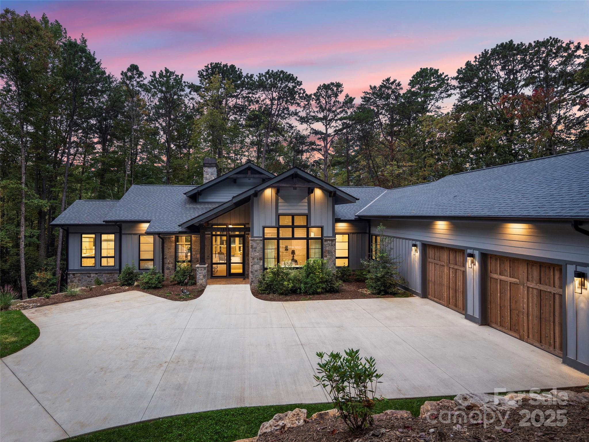 1565 Country View Way Arden, NC 28704 - Photo 2 of 31 a front view of a house with a yard and outdoor seating