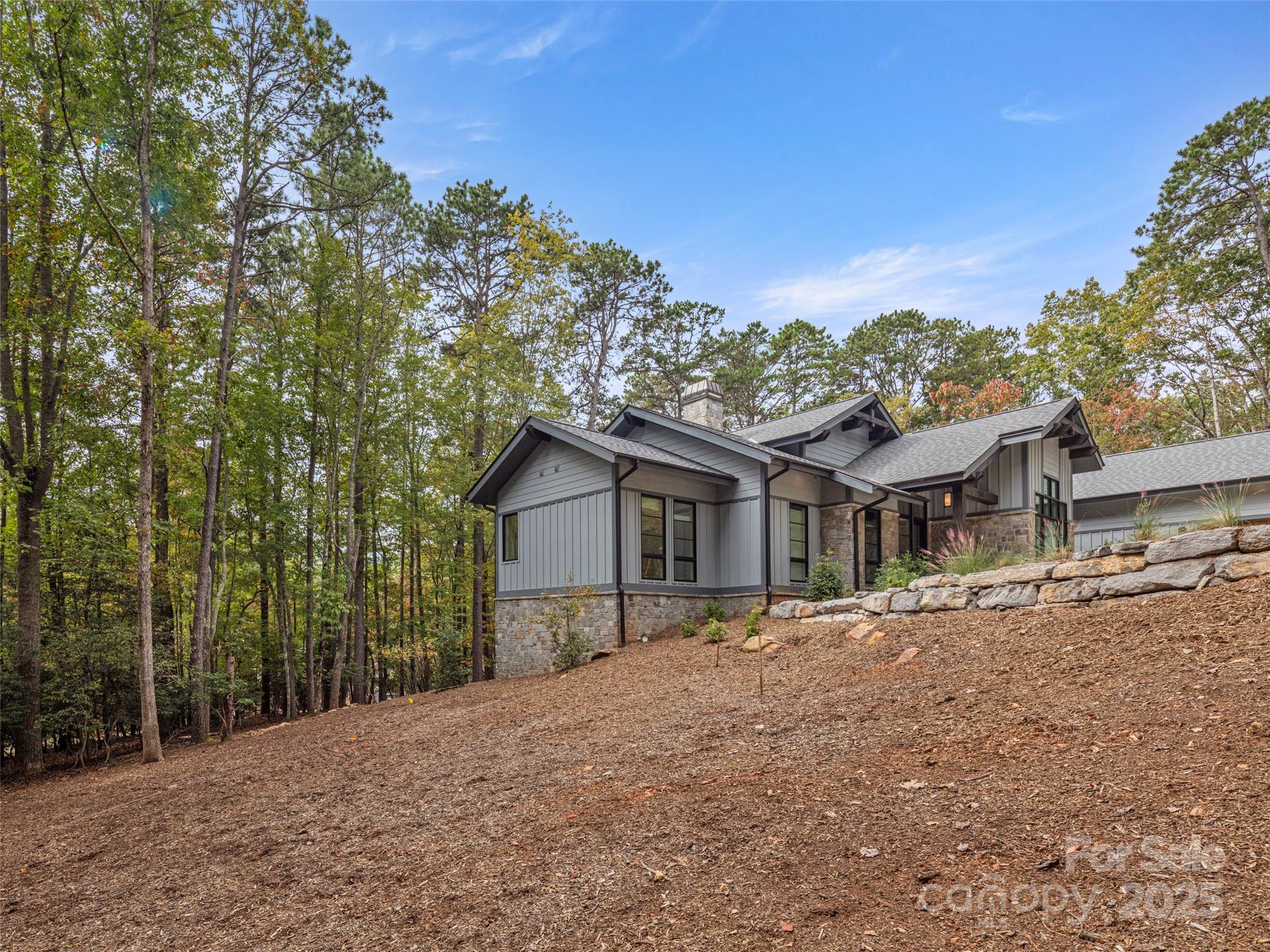 1565 Country View Way Arden, NC 28704 - Photo 30 of 31 a front view of a house with a yard and trees