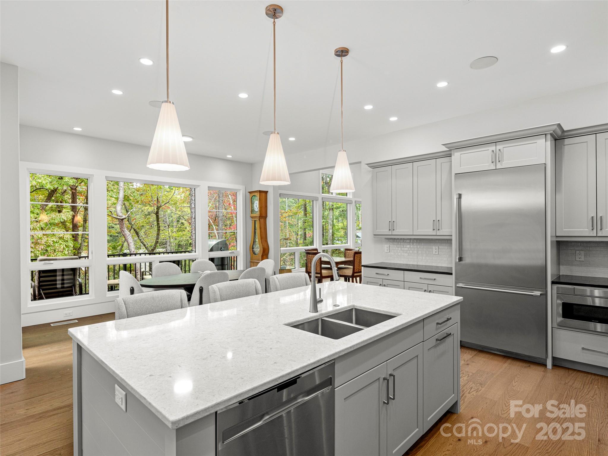 1565 Country View Way Arden, NC 28704 - Photo 8 of 31 a kitchen with stainless steel appliances granite countertop a sink a stove and a refrigerator