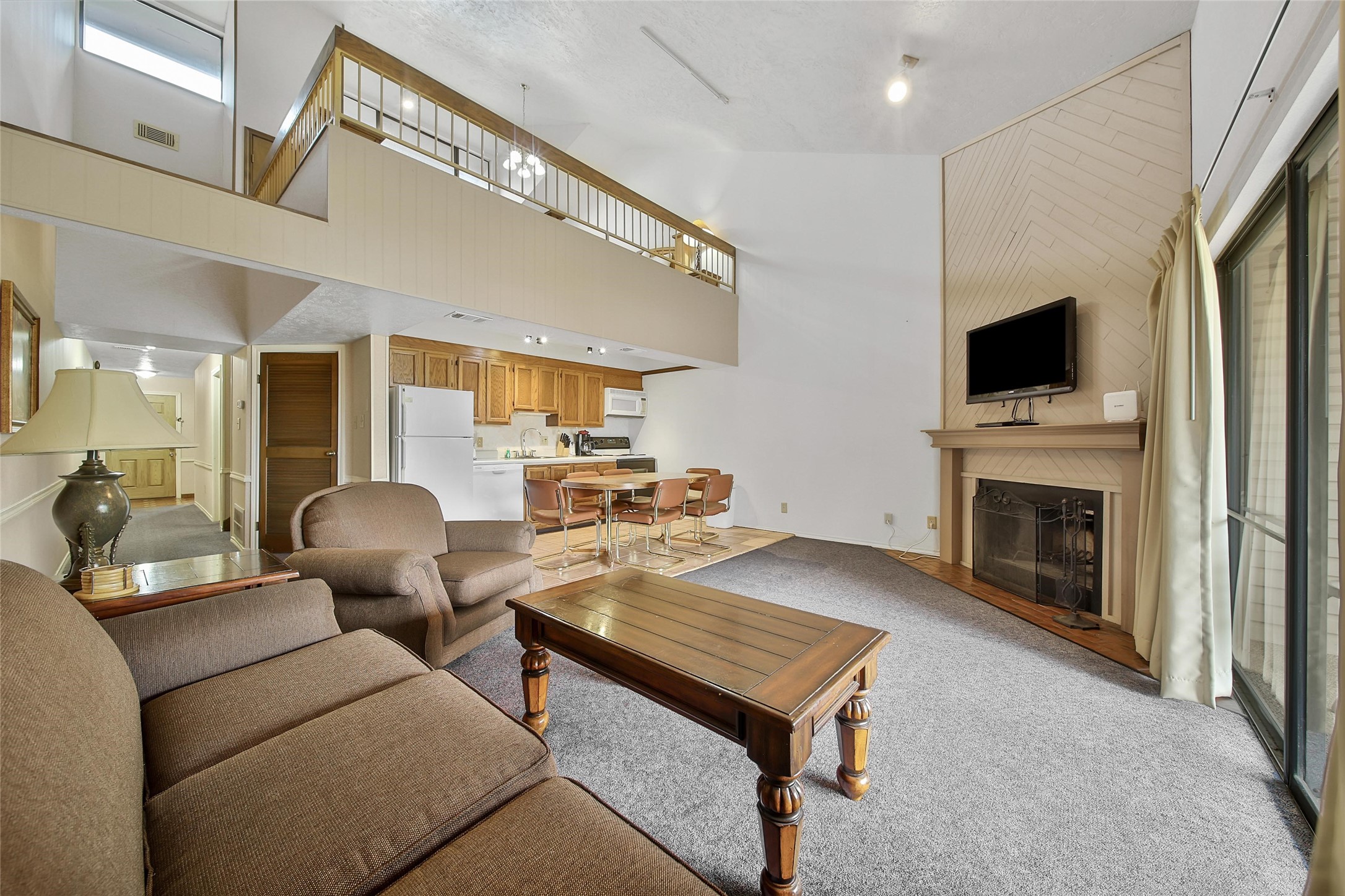 1000 April Sound Boulevard Conroe, TX 77356 - Photo 35 of 46 a living room with furniture and a fireplace