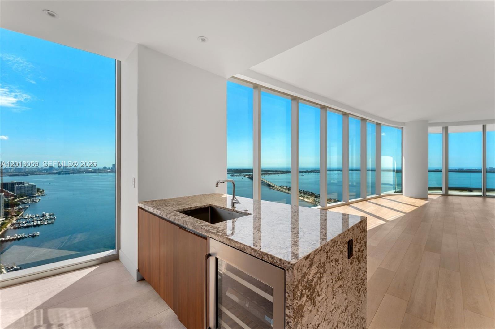 175 Southeast 25th Road, Unit 3601 Miami, FL 33129 - Photo 10 of 27 a kitchen with a sink and large window