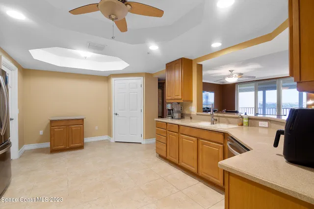 a kitchen with cabinets a sink and appliances