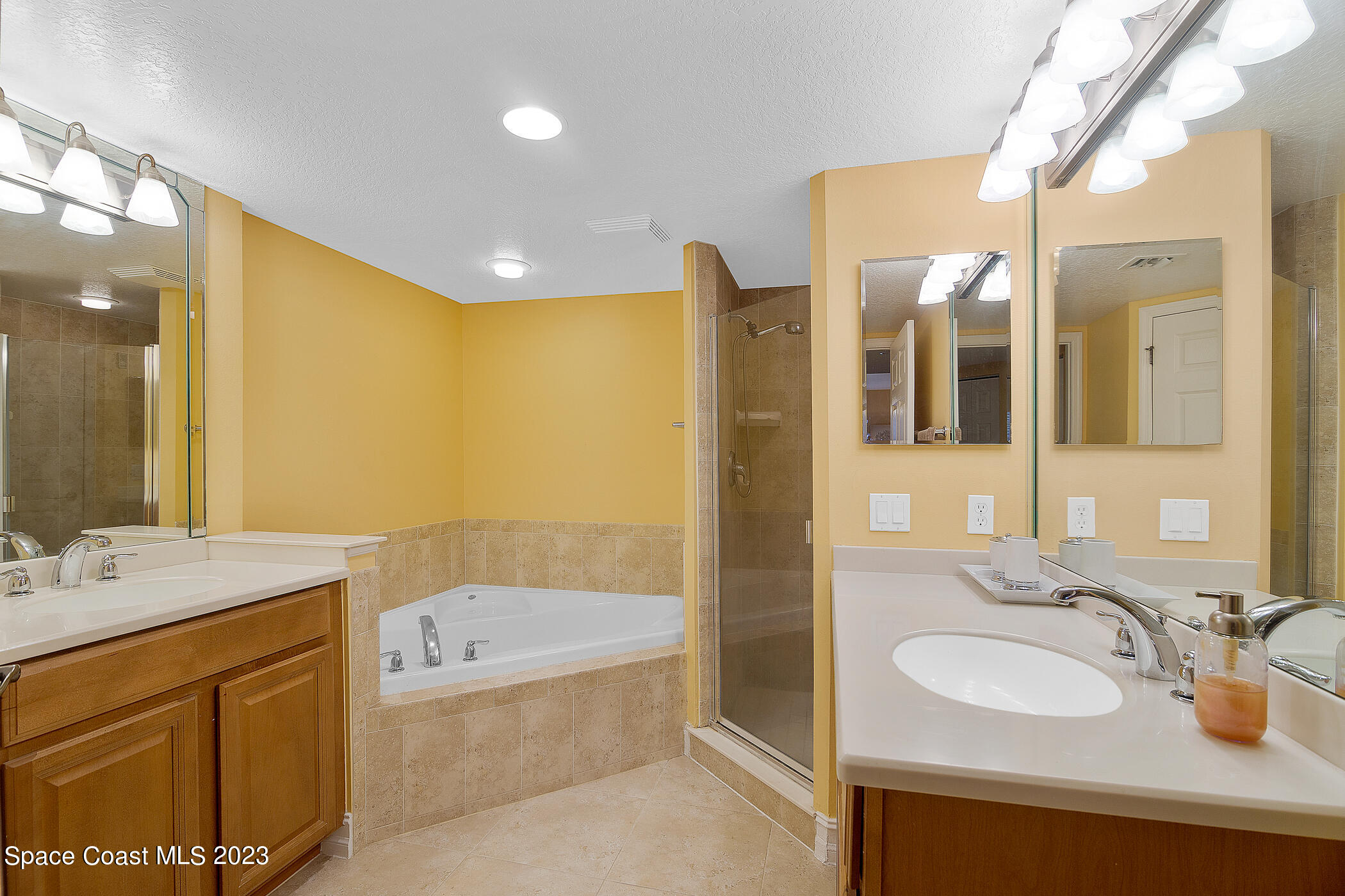 134 Starboard Lane, Unit 306 Merritt Island, FL 32953 - Photo 22 of 42 a bathroom with a sink double vanity and a mirror