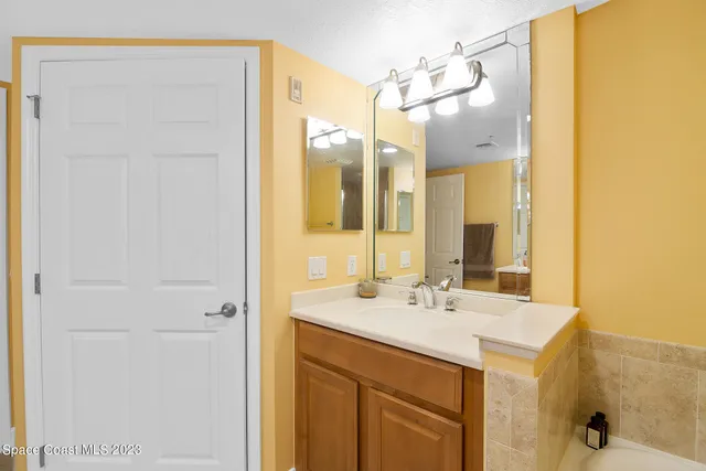 a bedroom with two beds and a couch