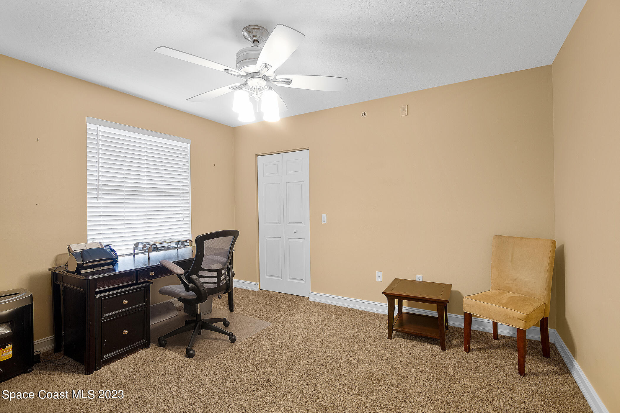 134 Starboard Lane, Unit 306 Merritt Island, FL 32953 - Photo 28 of 42 a view of a workspace with furniture and a window