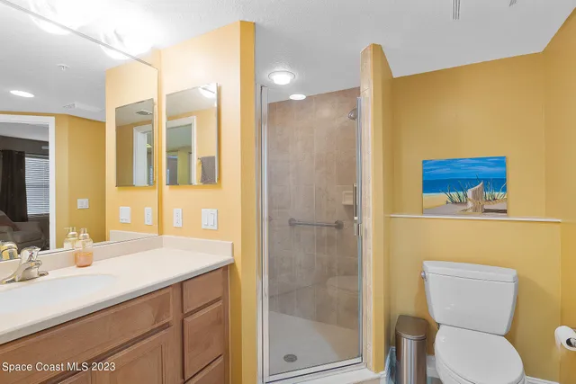 a picture of a room with toys and refrigerator