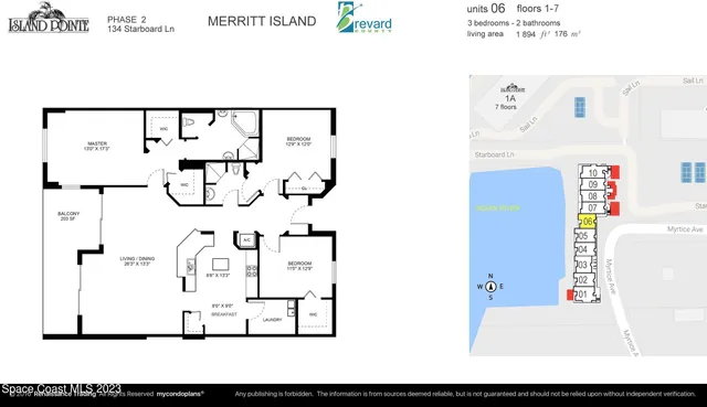 a view of a lake with a large building