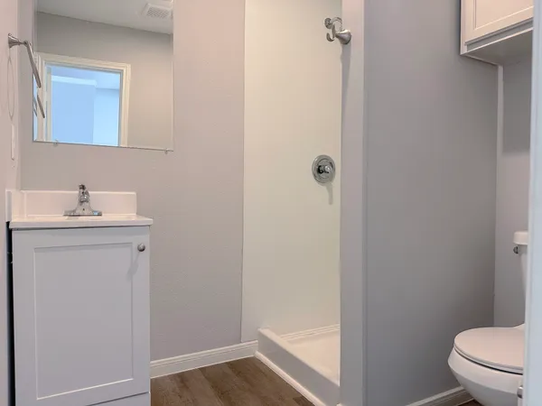a bathroom with a sink toilet and vanity