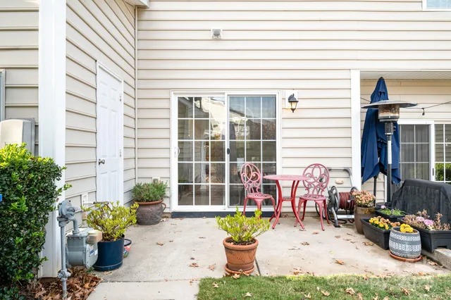 a front view of a house with outdoor seating