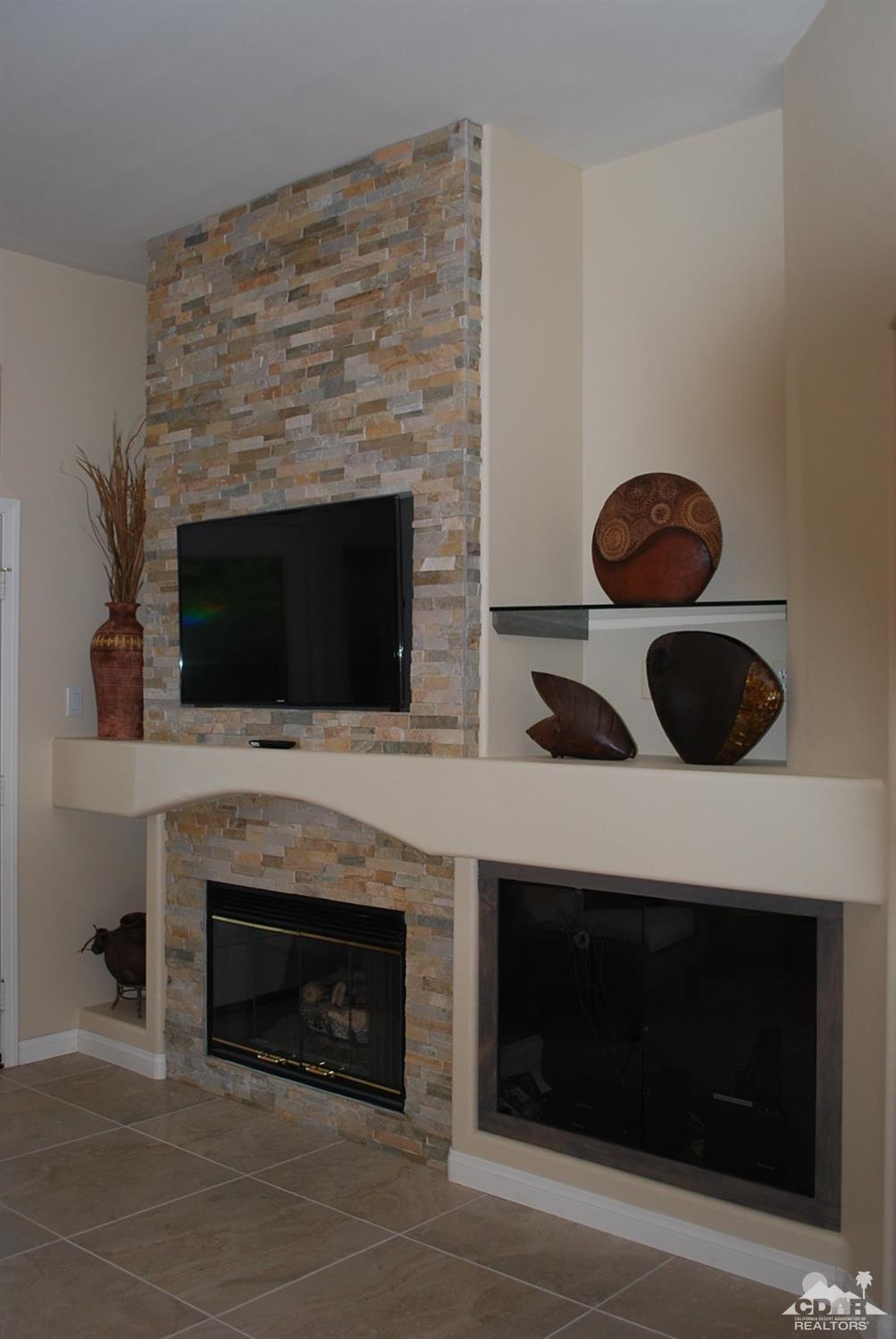 78082 Hunter Point Road Palm Desert, CA 92211 - Photo 18 of 38 a kitchen with a stove and a microwave