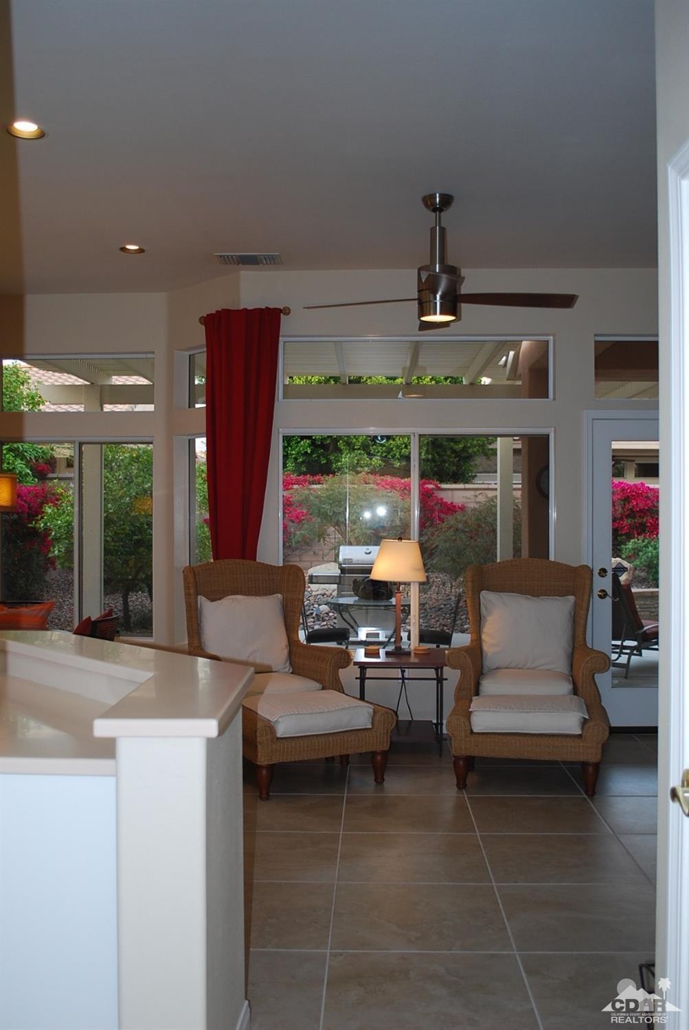 78082 Hunter Point Road Palm Desert, CA 92211 - Photo 19 of 38 a outdoor space with the couches and dining table with the kitchen view