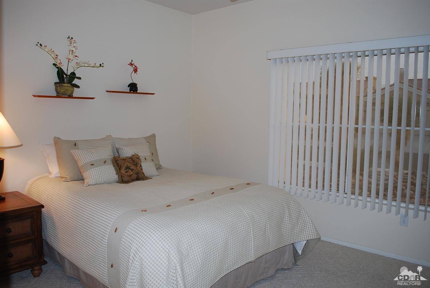 78082 Hunter Point Road Palm Desert, CA 92211 - Photo 24 of 38 a bedroom with a bed and a window
