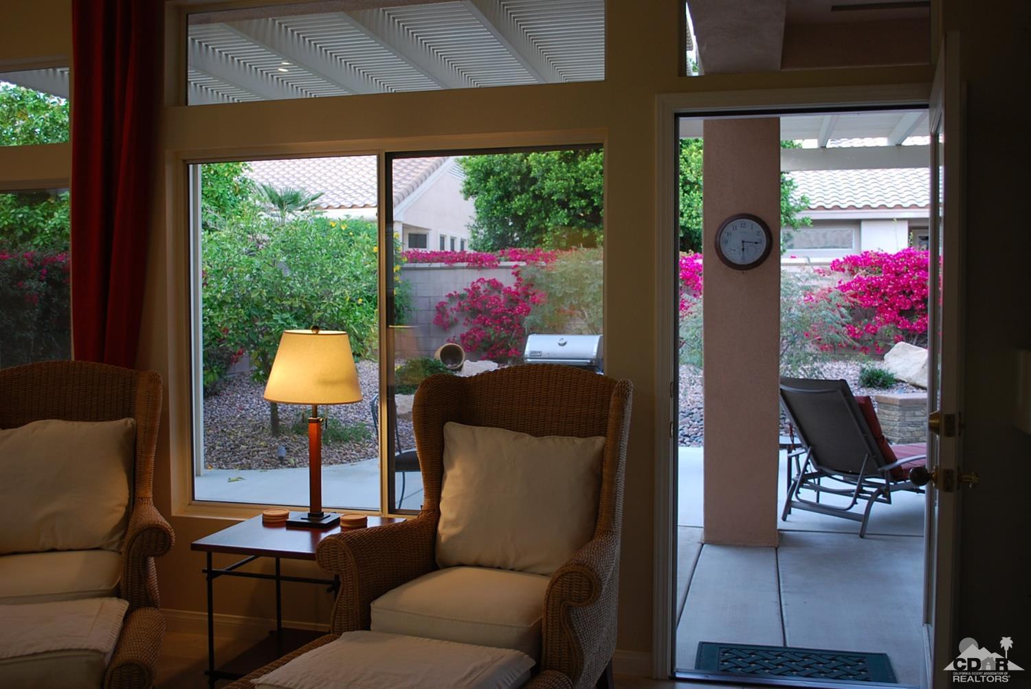78082 Hunter Point Road Palm Desert, CA 92211 - Photo 26 of 38 a living room with furniture and a large window