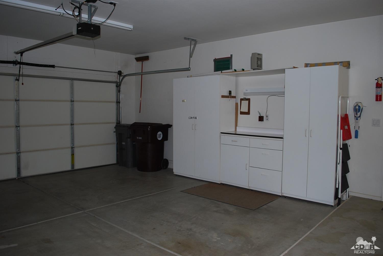 78082 Hunter Point Road Palm Desert, CA 92211 - Photo 29 of 38 a view of a garage