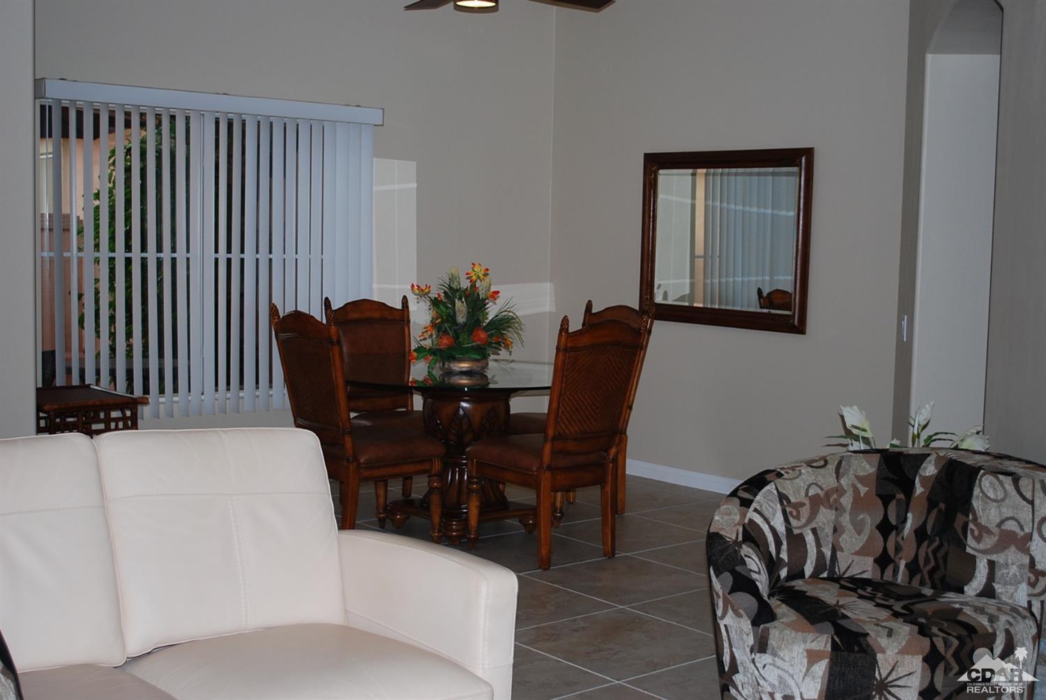 78082 Hunter Point Road Palm Desert, CA 92211 - Photo 4 of 38 a view of a dining room with furniture