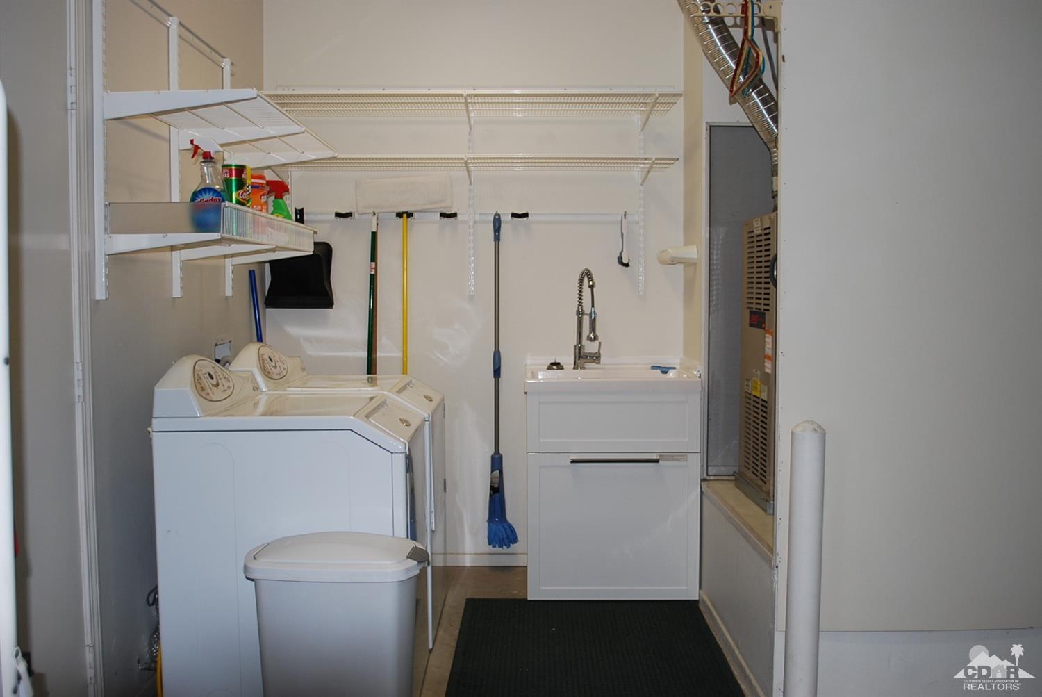 78082 Hunter Point Road Palm Desert, CA 92211 - Photo 31 of 38 a utility room with dryer and washer