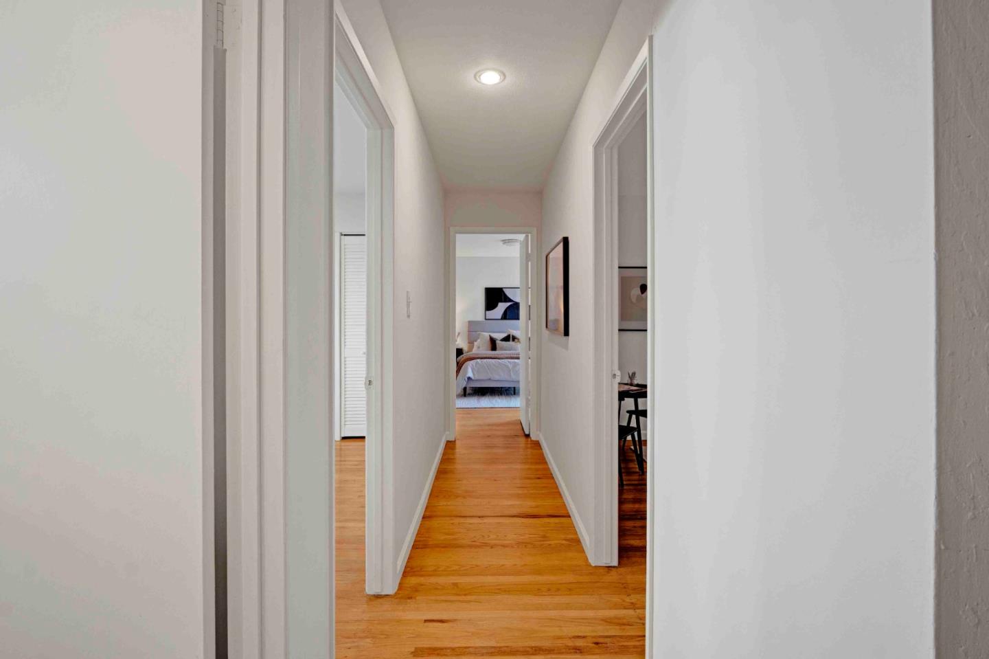335 Spode Way San Jose, CA 95123 - Photo 23 of 35 a view of a hallway with wooden floor and staircase