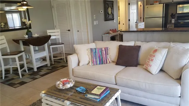 a living room with furniture tv and a fireplace