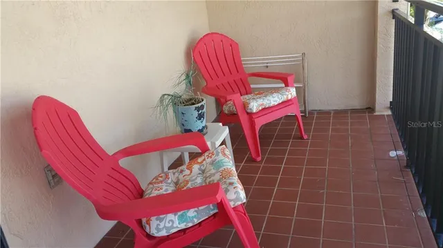 a view of a backyard with a sitting area