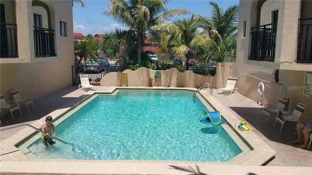 a view of a patio with table and chairs with wooden floor