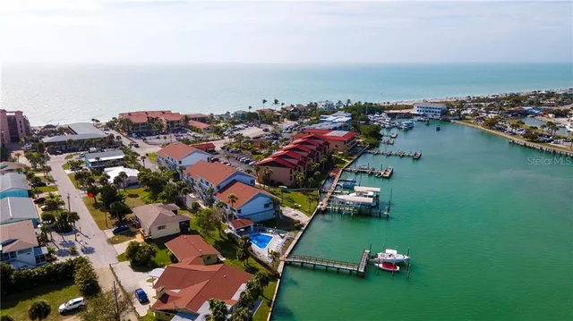 an aerial view of a house with a lake view