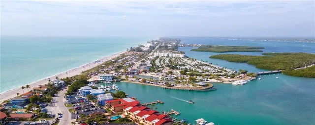 an aerial view of a house with a lake view