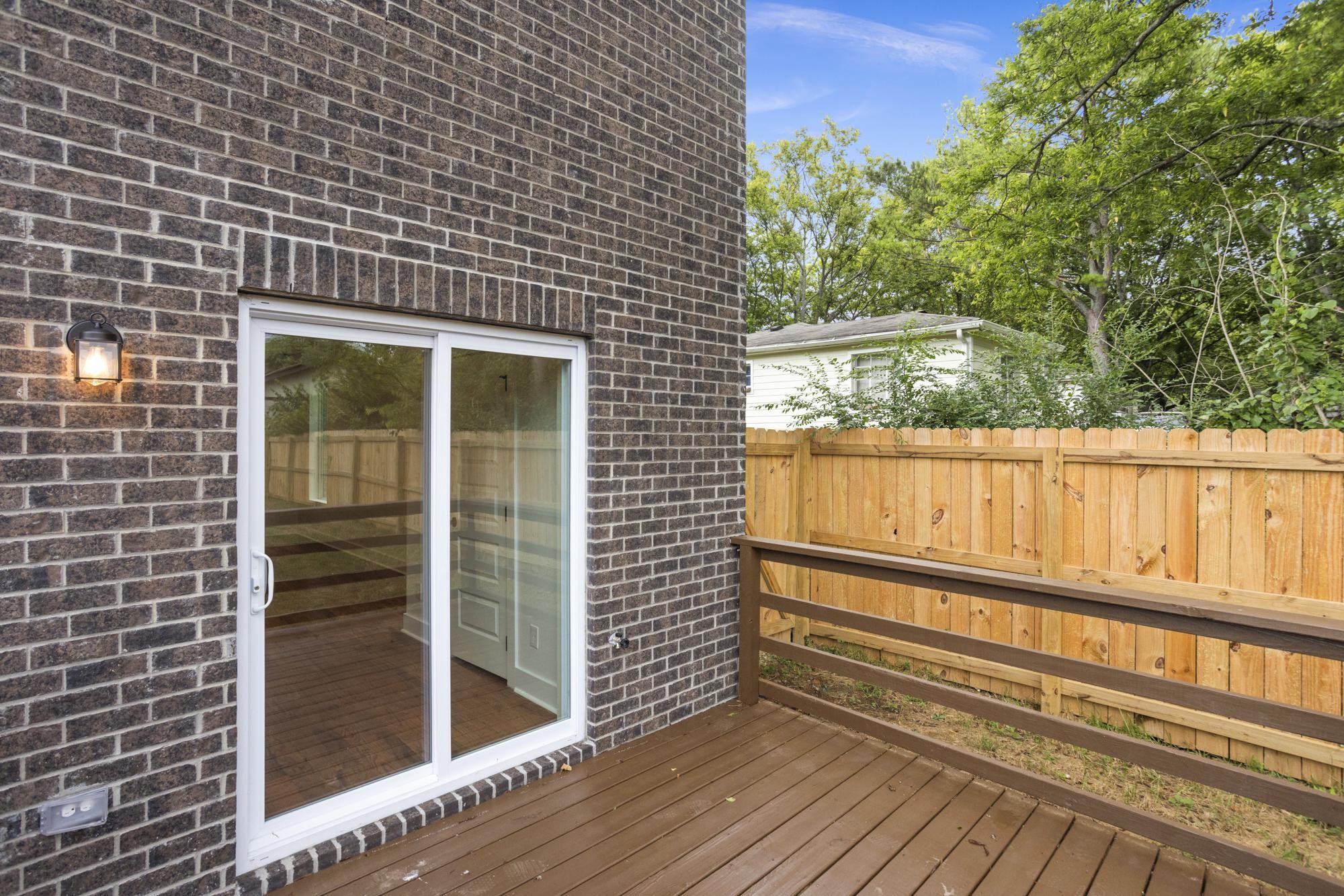 507 Demoss Street, Unit 110 Gallatin, TN 37066 - Photo 14 of 27 a view of a wooden door and a floor to ceiling window